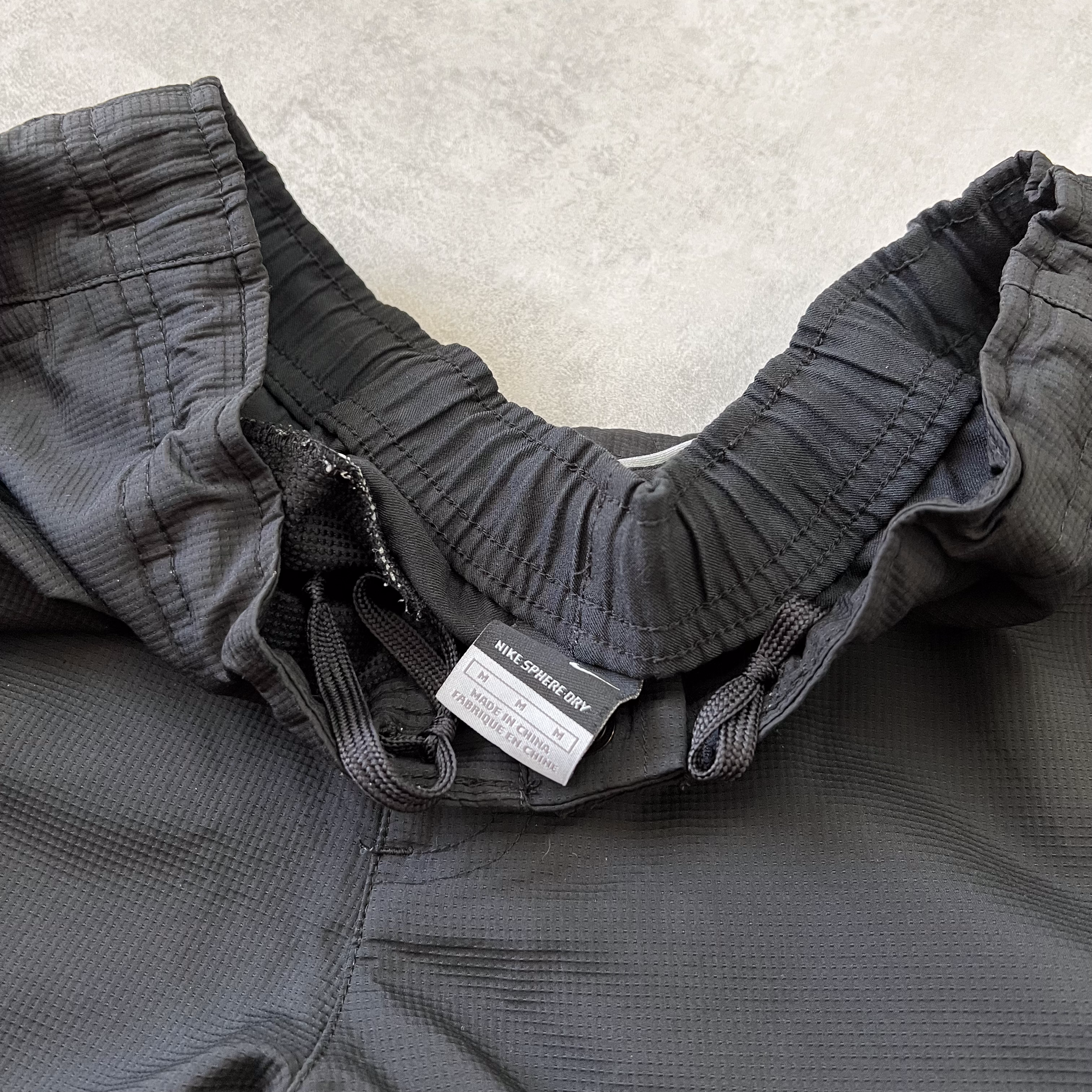 Nike 2000s double swoosh trackpants (M)