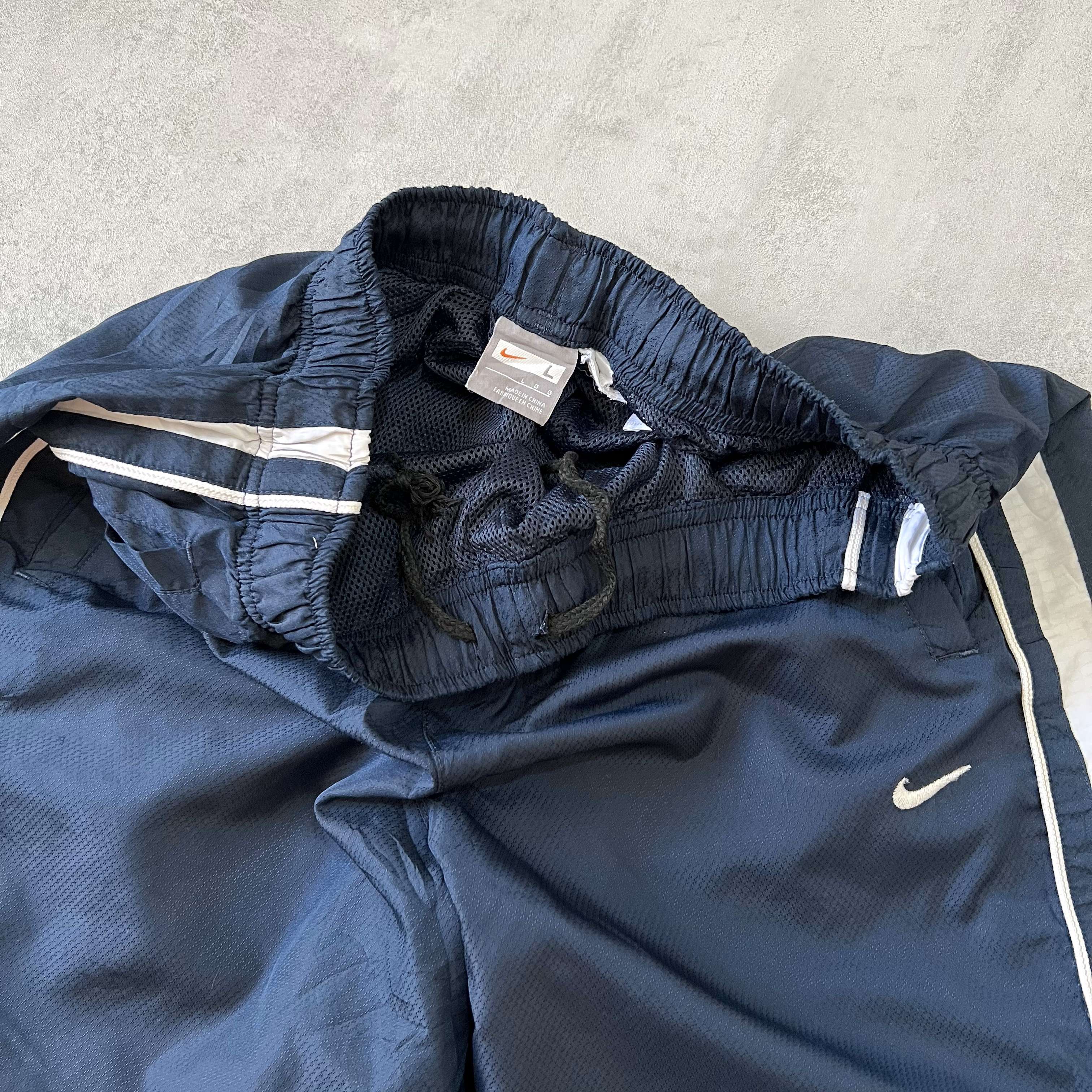 Nike 1990s striped trackpants (M)