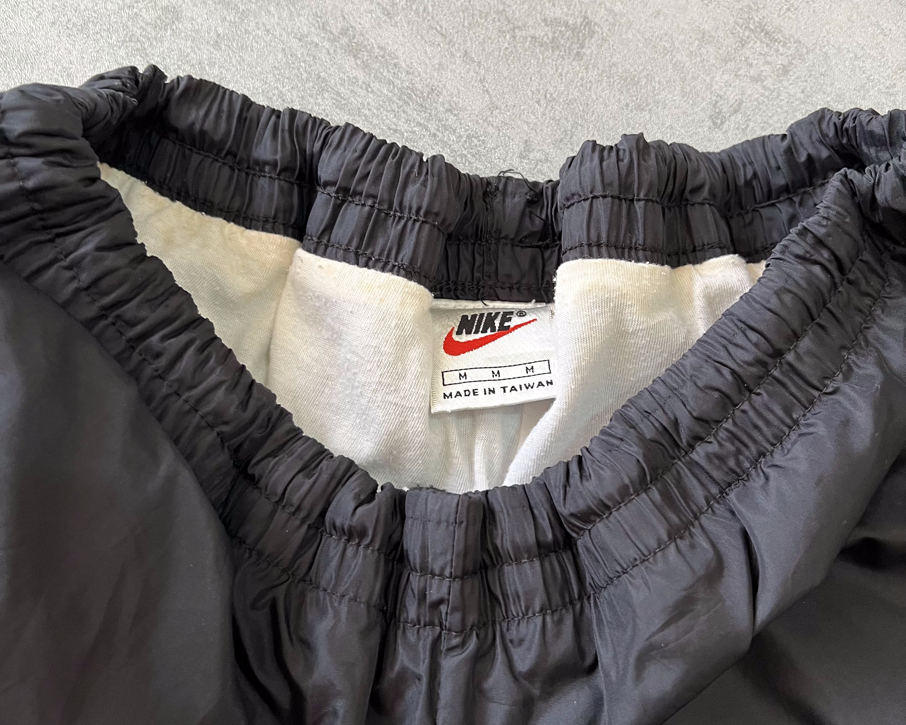 Nike 1990s double swoosh track pants (M)