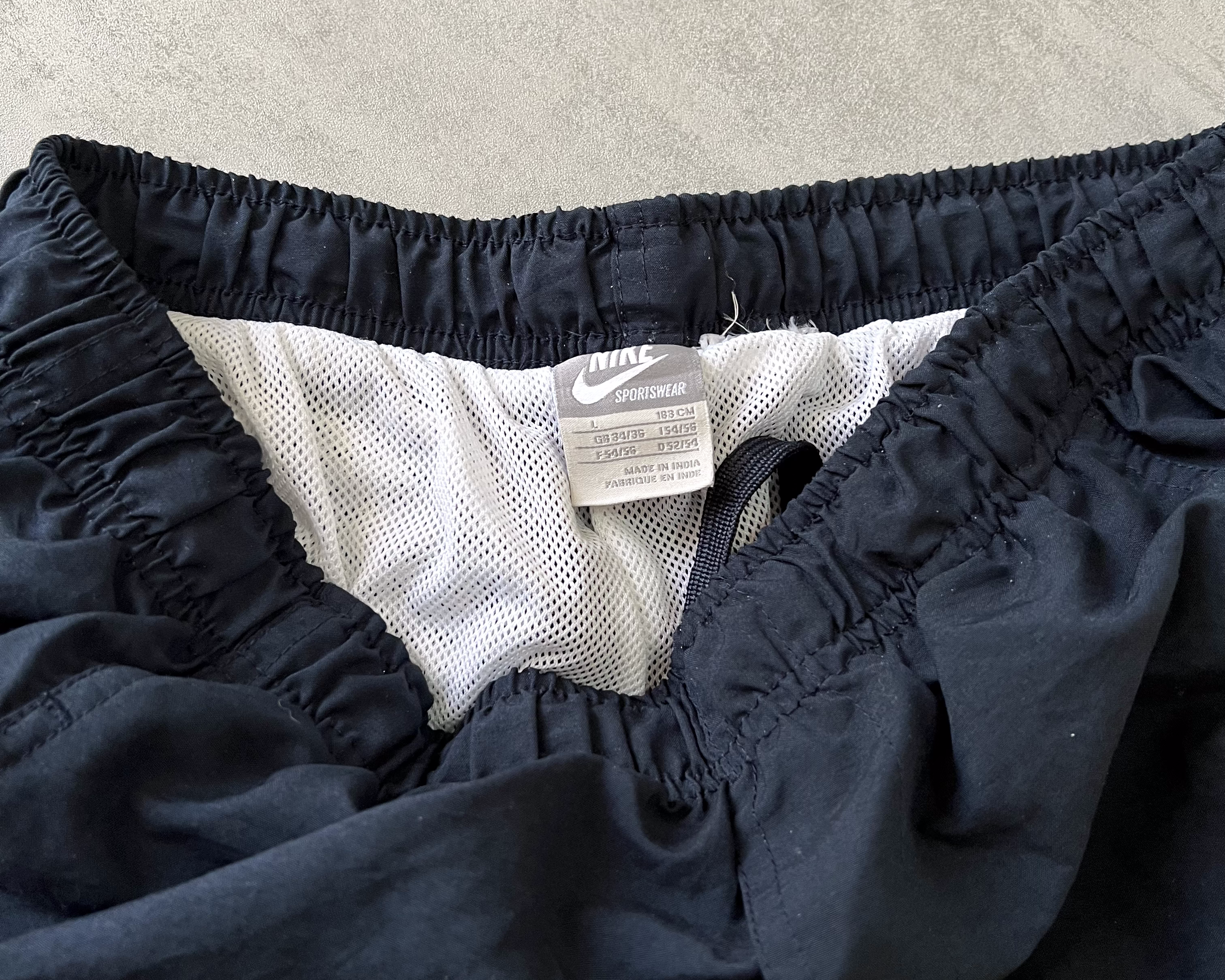 Nike RARE 2000s track pants (L)