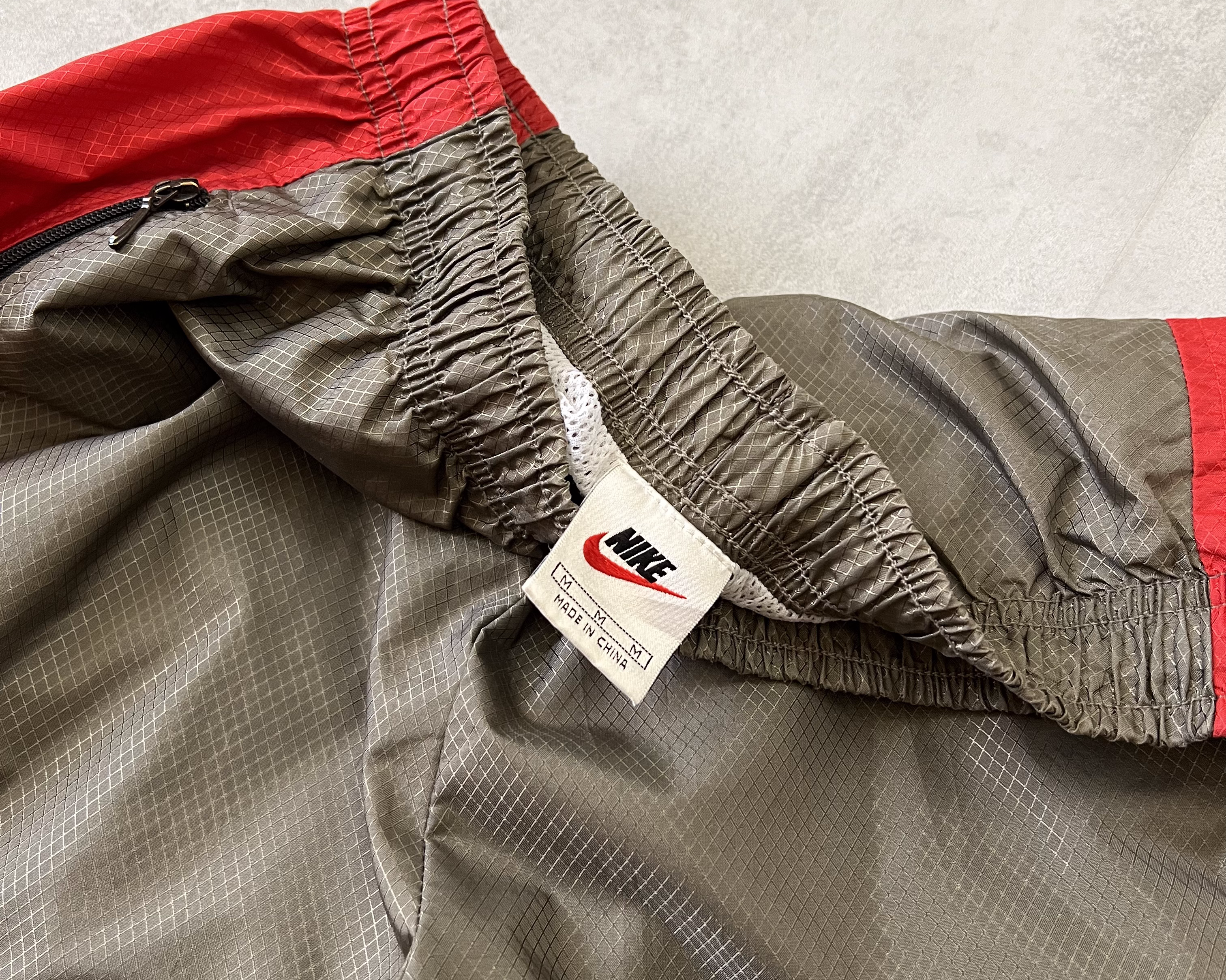 Nike 2000s double swoosh track pants (M)