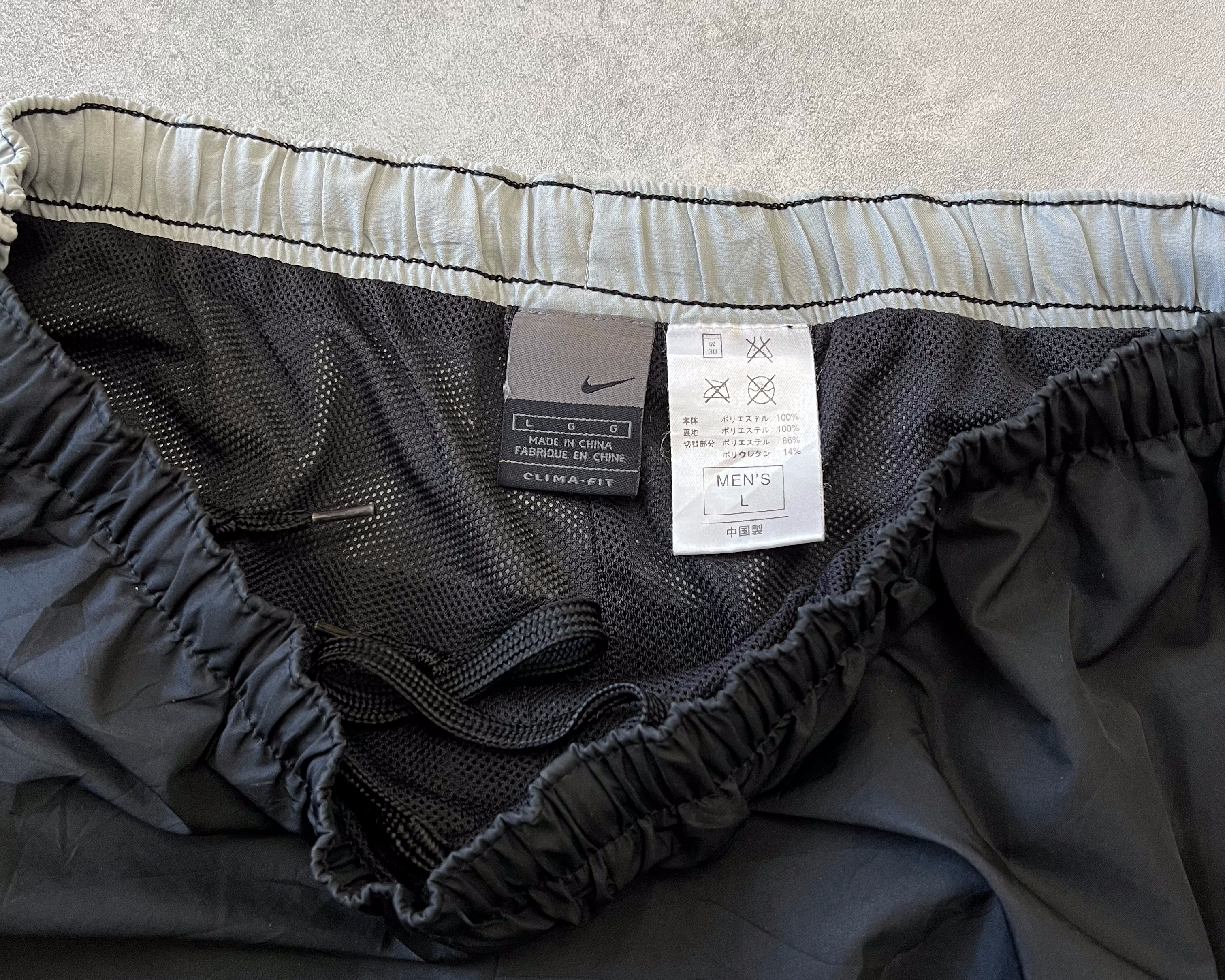 Nike 2000s double swoosh track pants (L)
