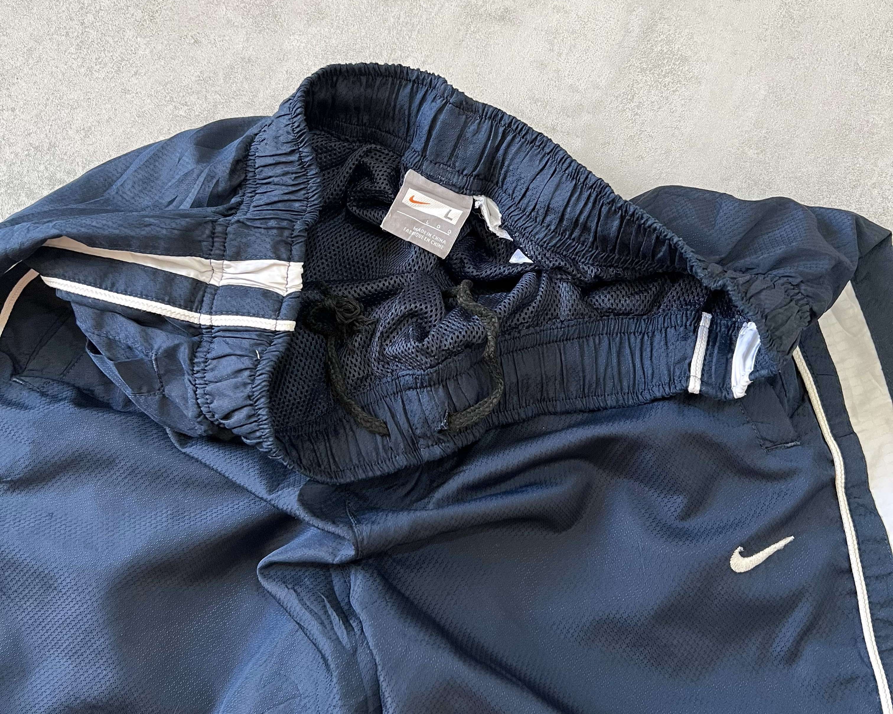 Nike 1990s striped track pants (M)