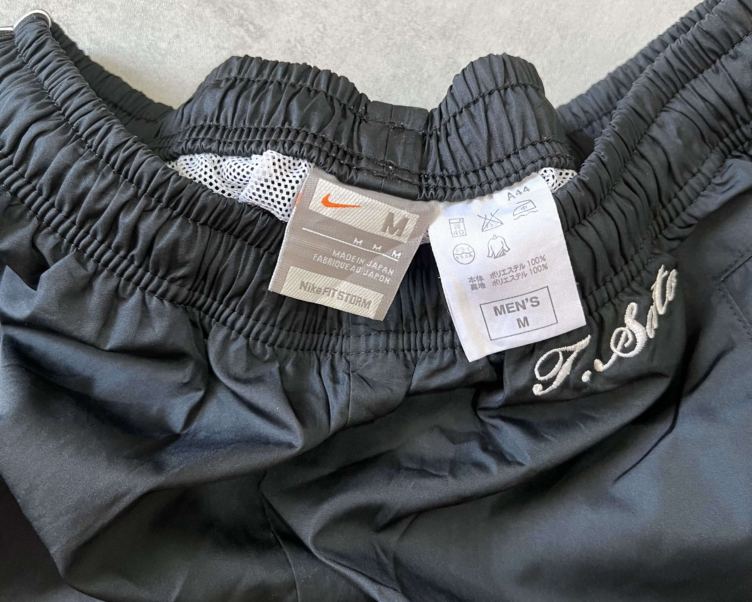 Nike 2000s center swoosh track pants (M)